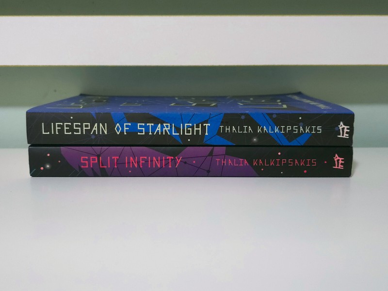 Lot of 2x Thalia Kalkipsakis PB Books: Lifespan of Starlight & Split Infinity! gallery